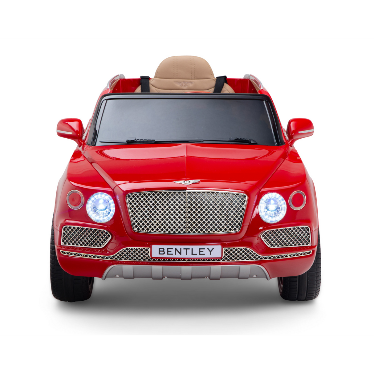 The Red 12V Bentley Bentayga Kids Licensed 1 Seater Ride On Car offers a striking replica experience with large headlights, detailed grille, side mirrors, and a luxurious tan leather seat.