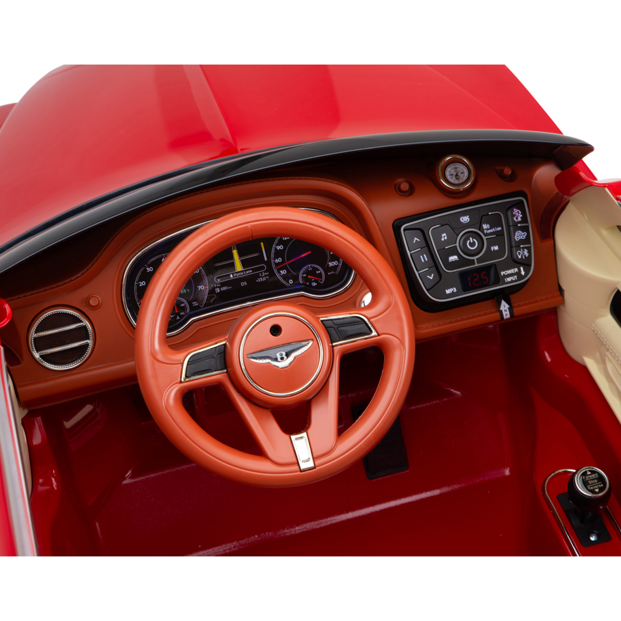 Close-up of the Red 12V Bentley Bentayaga Kids Ride On Cars interior shows a red steering wheel with the Bentley logo, dashboard gauges, buttons, and a digital clock at 12:51. It mimics luxury with features like leather seats in this miniature design.