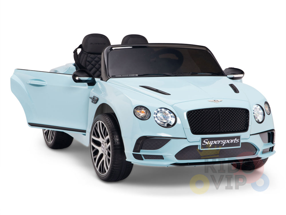 The Blue 12V Bentley GTC Kids Licensed Ride On Car offers a luxury experience with rubber wheels, two leather seats, a Supersports license plate, and realistic details such as headlights, side mirrors, and an open drivers side door. Includes remote control.