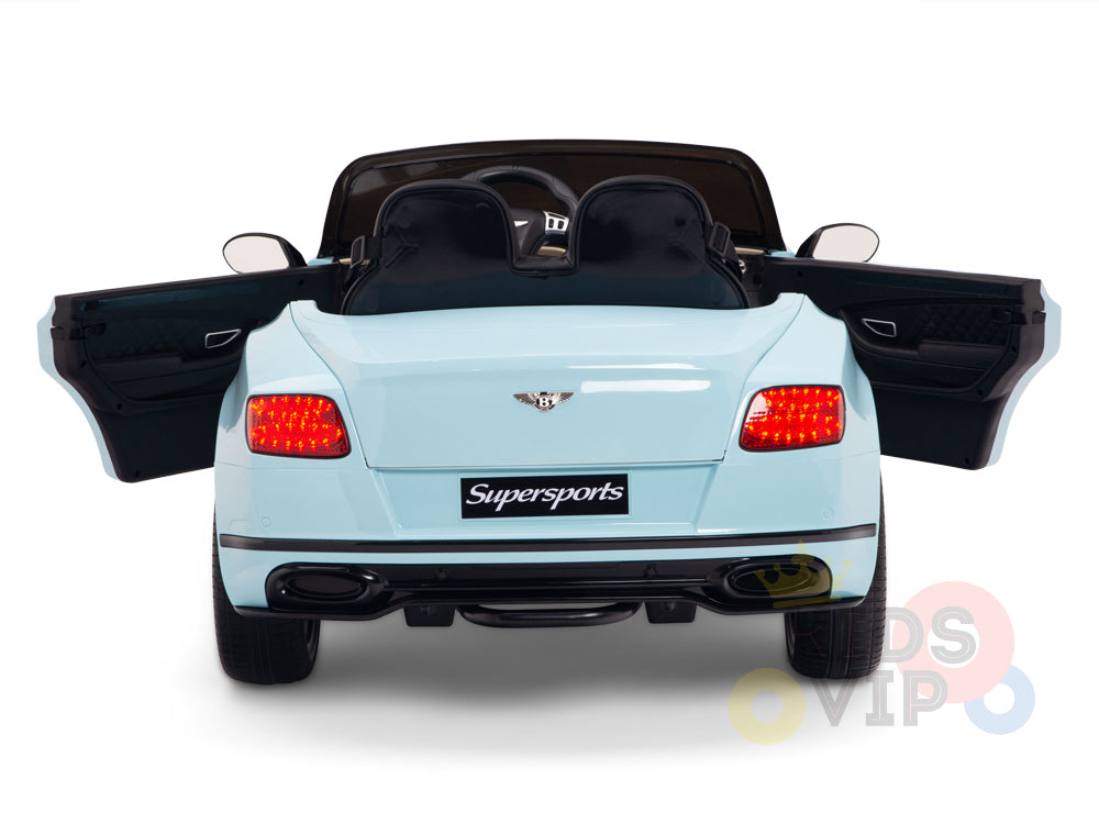 The Blue 12V Bentley GTC Kids Licensed Ride On Car is displayed from the rear with open doors and glowing taillights, featuring the Supersports emblem. Inside, a leather seat and steering wheel are visible, hinting at its remote control capabilities for an exciting ride.