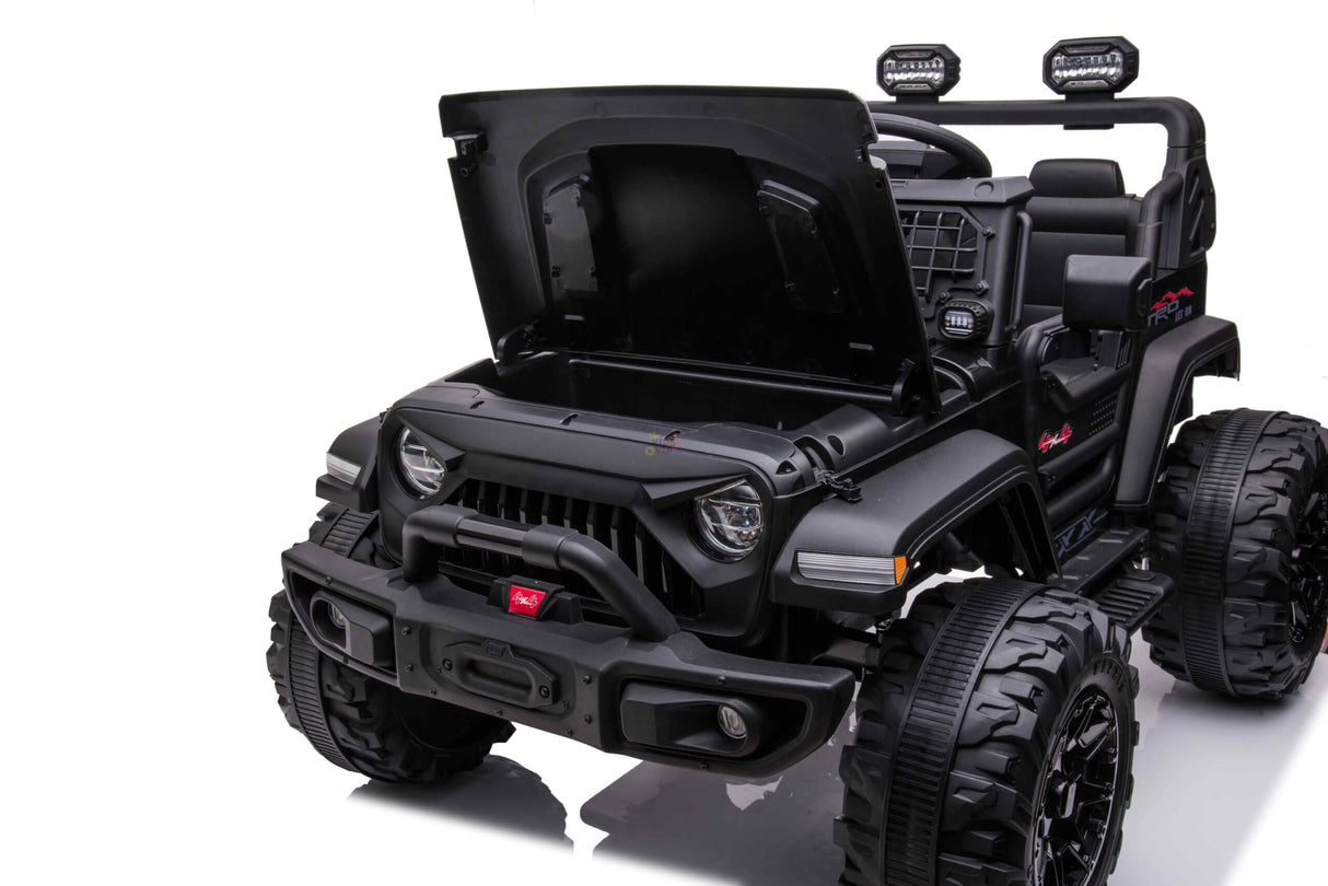 The Black 24V/4WD Xtreme Ride-On Truck boasts EVA wheels, leather seats, chunky tires, an open hood, a front bumper with headlights, and extra lights on top. This childrens off-road style toy car seats two and contrasts strikingly against a white background.