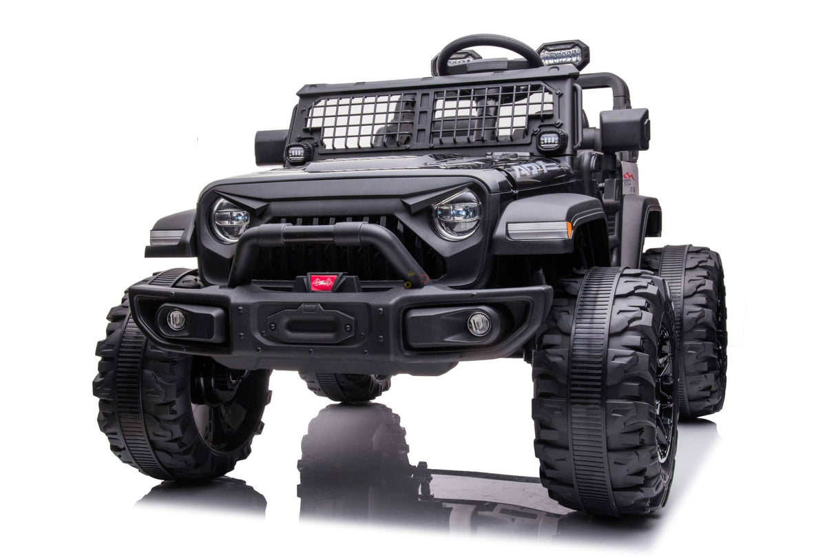 The Black 24V/4WD Xtreme Ride on Truck features rugged EVA wheels, leather seats, grille guards, side mirrors, and headlights. Its detailed design and reflective white surface highlight the imposing structure of this impressive kids vehicle.
