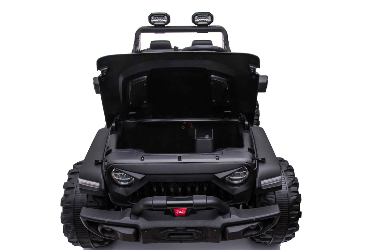 The Black 24V/4WD Xtreme Ride-on Truck features rugged Eva wheels, large tires, leather seats, a roll bar with dual spotlights, and storage under an open hood. Photographed on a plain white background, its the ultimate adventure toy for little explorers.