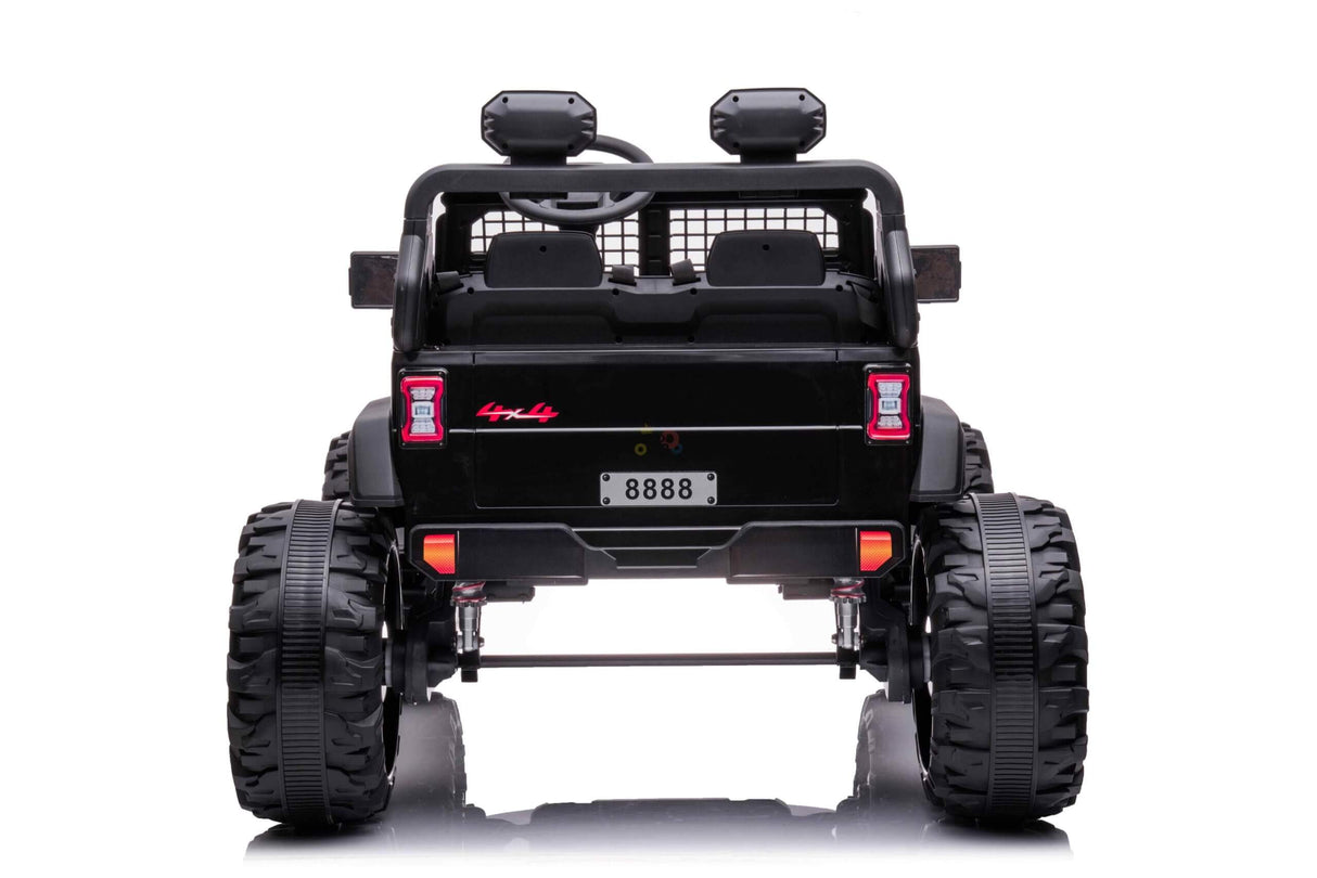Rear view of a Black 24V/4WD Xtreme Ride on Truck with oversized Eva wheels, red rear lights, and license plate 8888. The toy jeep also features a visible steering wheel and headrests inside.