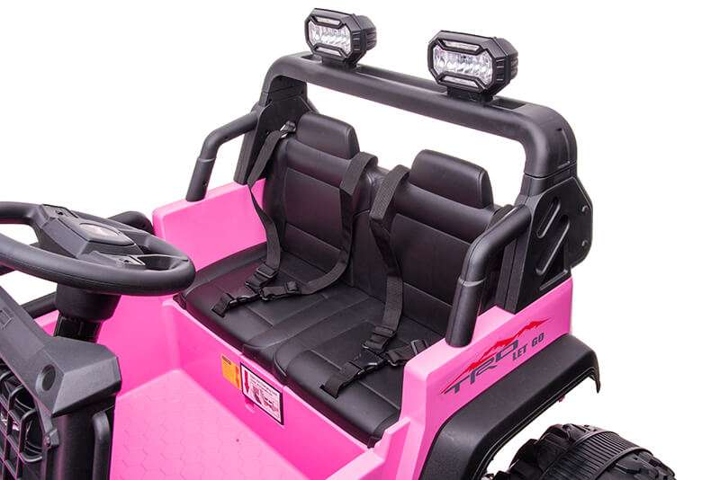 The Pink 24V/2WD Xtreme Edition Ride on Truck features a vibrant pink body, Eva wheels, black leather seats with seat belts, LED rooftop lights, black steering wheel, textured pink floor, and stylish decal designs.
