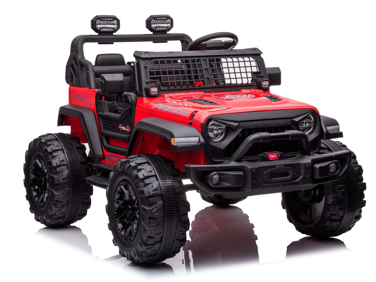 The Red 24V/4WD Xtreme Ride on Truck features large black EVA wheels, leather seats, roll bars with lights, a front grill, windshield, side mirrors, and striking hood graphics for added realism.