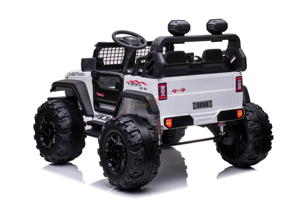 The White 24V/4WD Xtreme Ride on Truck features large black EVA wheels, leather two-seater open-top design, steering wheel, realistic dashboard, and rear taillights with license plate 8888.