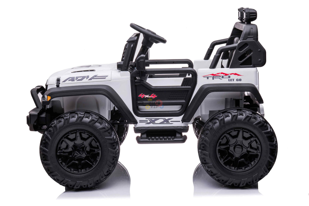 The White 24V/4WD Xtreme Ride-On Truck features large black Eva wheels, leather seats, a roll cage, ADV and LET GO decals, a 2-seater design with a drivers seat and steering wheel, and a top-mounted light.