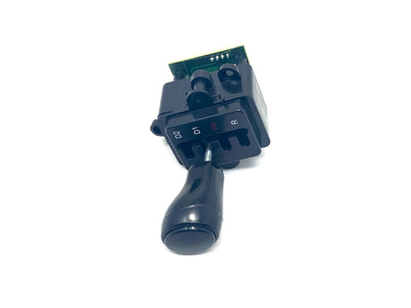 The 12V LaFerrari Shifter is a black joystick lever with a rectangular base labeled D2, D1, and R, mounted on a green circuit board against a white background, designed to boost performance in ride-on cars.