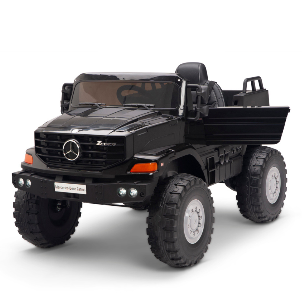 The Black 24V XXL Mercedes-Benz Zetros Kids Ride On Truck with RC is a two-seater featuring a rugged design, large tires, realistic headlights, an iconic grille with the Mercedes logo, and an open cab showing the drivers seat and steering wheel.