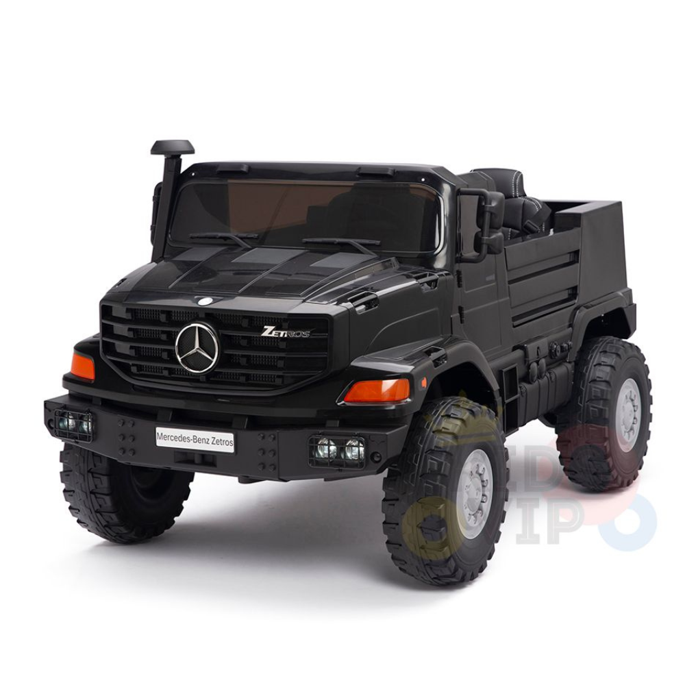 The Black 24V XXL Mercedes Benz Zetros Kids Ride On Truck with RC is a toy model featuring large wheels, a detailed front grille, working headlights, and side mirrors, displayed on a clean white background.