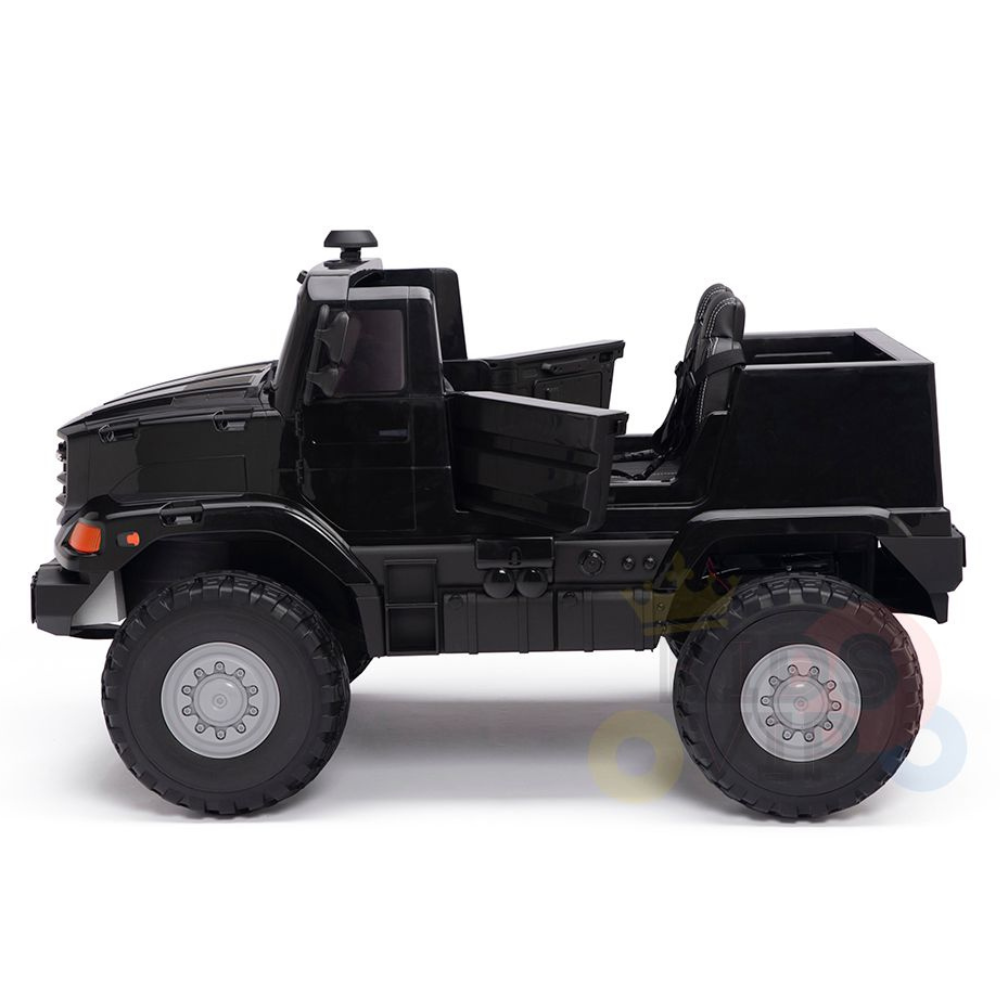 The Black 24V XXL Mercedes Benz Zetros Kids Ride On Truck with RC features large wheels, visible seats in an open cab, a small cargo area, and detailed wheel rims. Its modeled for rugged adventures against a plain white background.