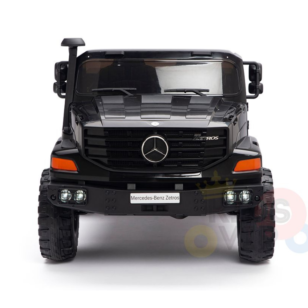 Front view of the Black 24V XXL Mercedes Benz Zetros Kids Ride On Truck with RC, showcasing its prominent grille, logo, and headlights. This 2-seater is built for rugged terrain with large tires and a robust build, all on a white background.