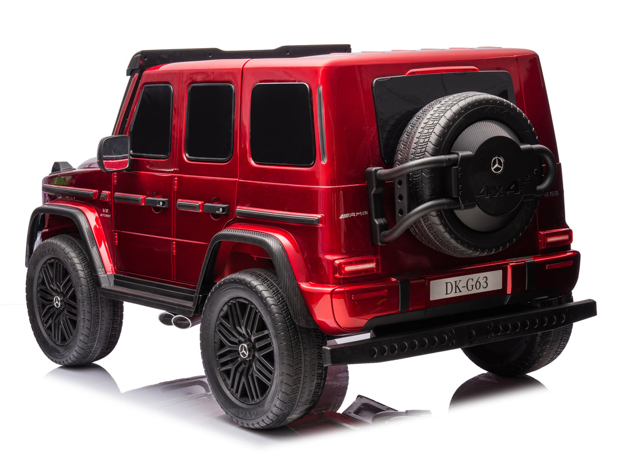 The Red Metallic 2x24V/4WD Platinum XXL Mercedes G63 Ride-On Truck features MP4, EVA wheels, and leather seats. It resembles a red Mercedes-Benz G-Class SUV with details like tinted windows, black wheels, a spare tire on the back, and remote control access—beautifully shown on a white background.
