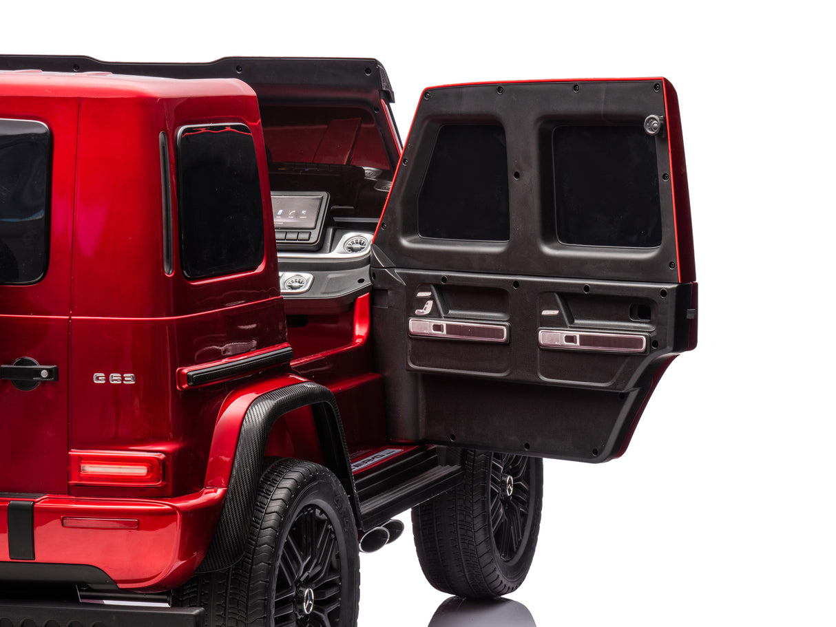 A red luxury SUVs open rear door displays a sleek dashboard, reminiscent of the Red Metallic 2x24V/4WD Platinum XXL Mercedes G63 Ride On Truck with MP4. Its shiny exterior and EVA wheels shine, while remote control offers complete command of this stylish vehicle featuring leather seats.