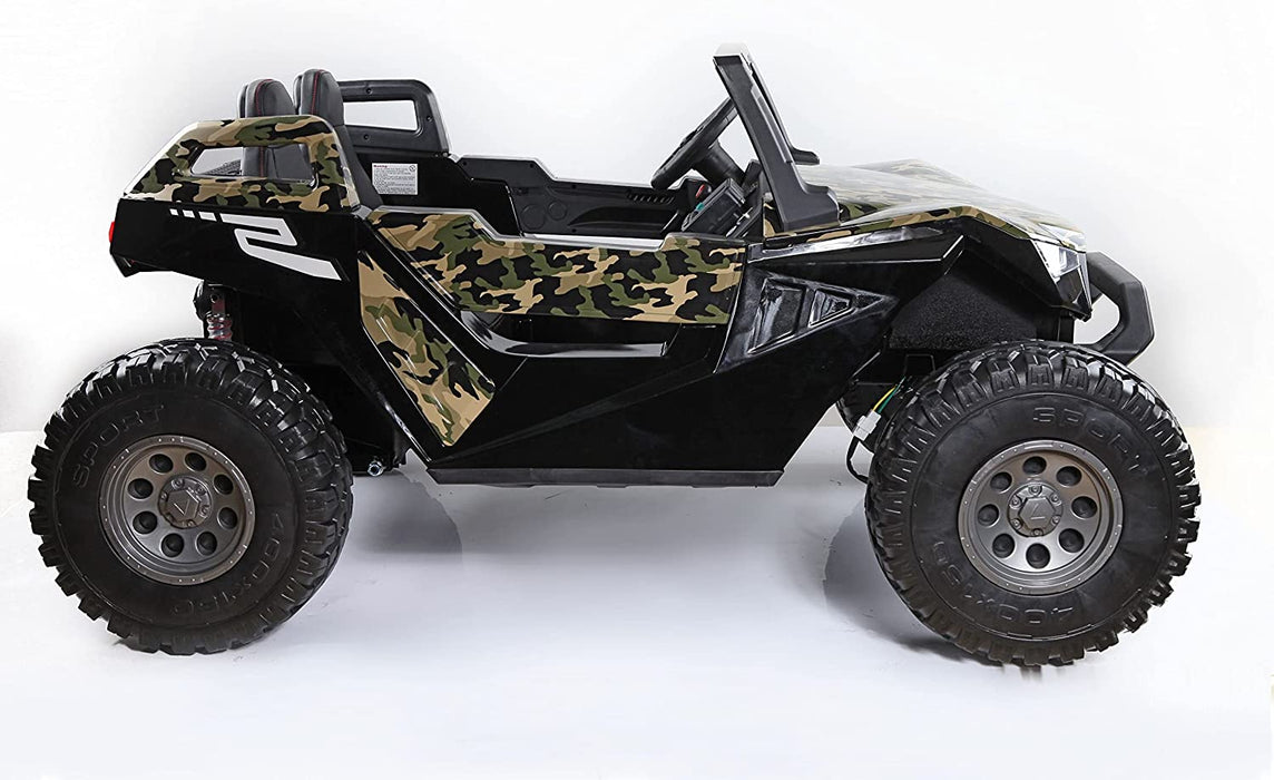 The Camo 24V/4X4 Dune Buggy Ride On UTV features a rugged off-road design with large rubber wheels, a camouflage-patterned body, an open-top with roll cage, black seats, and a compact angular frame.