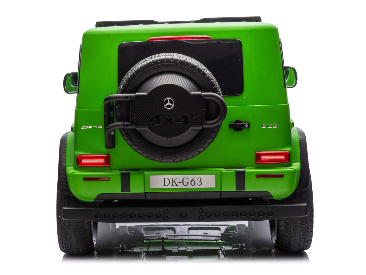 A green Mercedes G63 XXL Kids Ride-On Truck – Platinum Edition is shown from the rear, featuring a spare tire, taillights, and a DK-G63 license plate. With remote control, 24V 4WD, dual batteries, EVA tires, and leather seats, its ideal for young adventurers seeking fun.