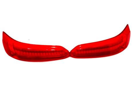 Close-up of two red, curved 12V Mercedes GTR taillight covers side by side on a white background, showing their translucent surface and internal structure. Final sale! Contact us for more info.