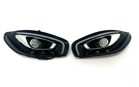 The 12V Mercedes GTR Set Of Headlights features sleek, angular designs with chrome accents and circular LED lights on a white background. Perfect for enhancing your ride-on car experience, these premium accessories are now available at final sale exclusively at kidsviponline.