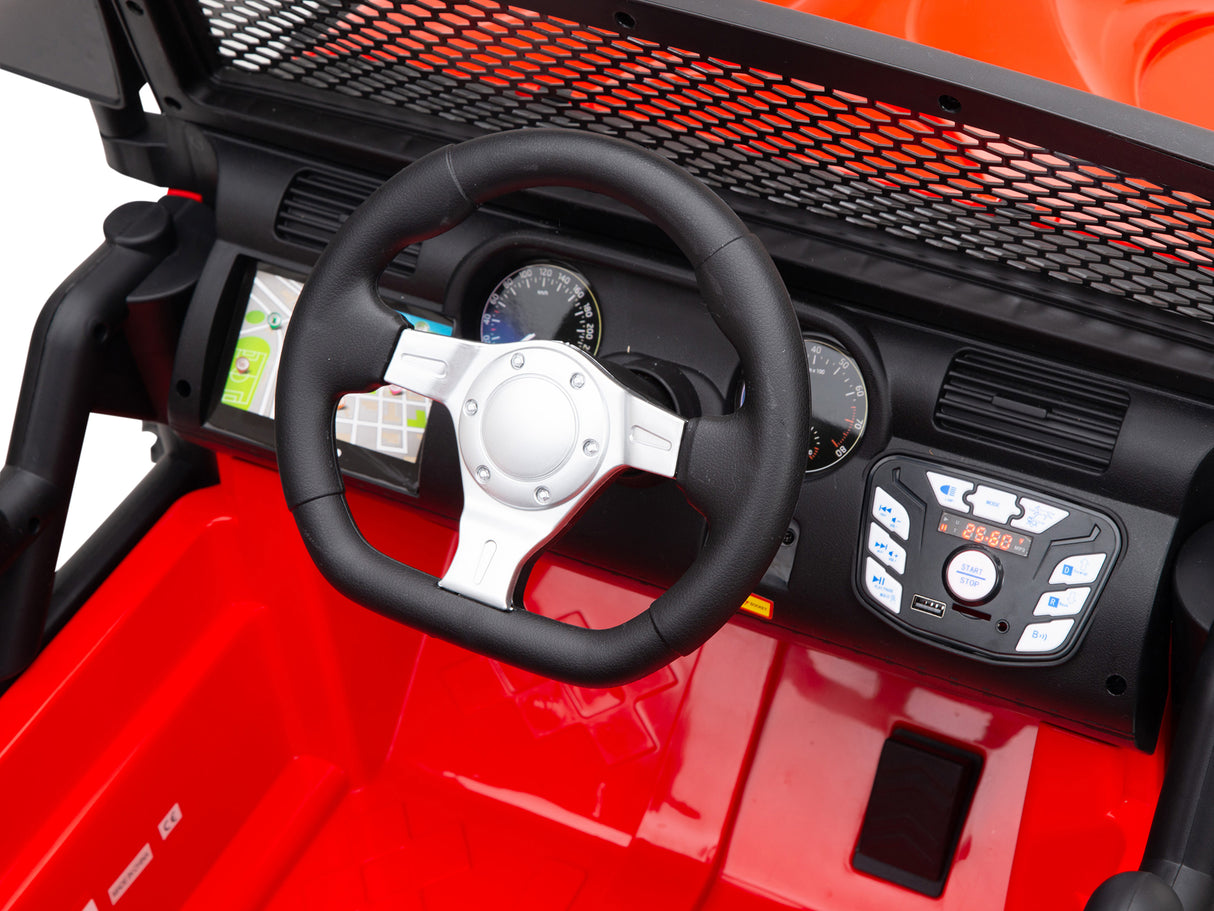 A close-up of the Red 24V EVA Big Wheels Kids 1 Seater Upgraded Ride On Truck reveals a toy car dashboard with a black steering wheel, digital display, control buttons, red interior, detailed gauges powered by a 24V battery, and a grid-patterned protective screen through the windshield.