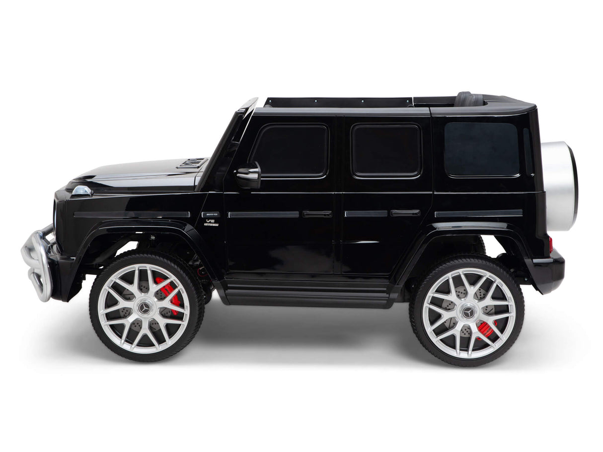 The Black 24V 2 Seats 4x4 Official Mercedes Benz G63 Kids Ride-On Car features chrome details, large silver wheels with red calipers, a rear spare tire, and a detailed design that mimics a real SUV.