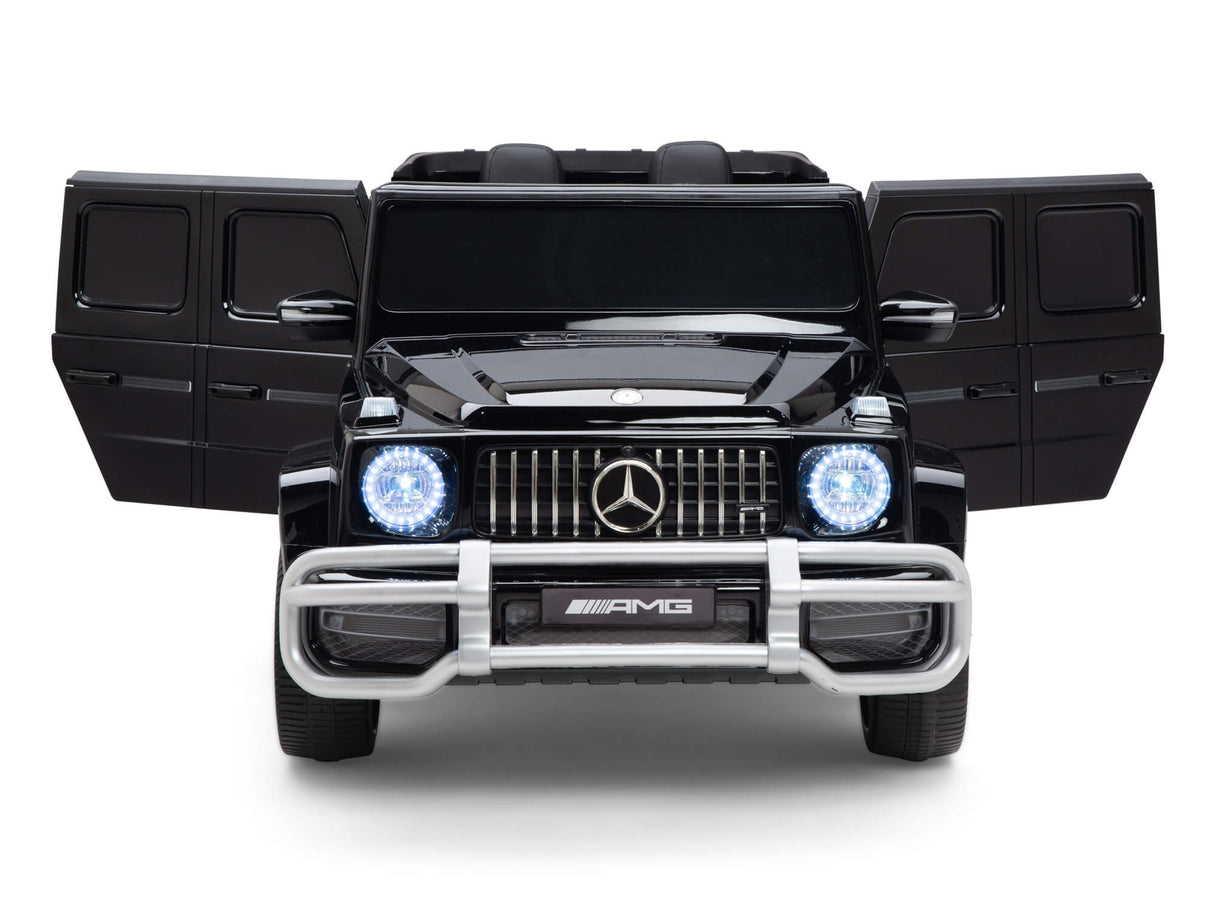 The Black 24V/4x4 Official Mercedes Benz G63 Ride On Car with RC features side-opening doors, illuminated circular headlights, and a detailed front grille. Perfect for young racers, its powerful 24V battery promises endless adventures.