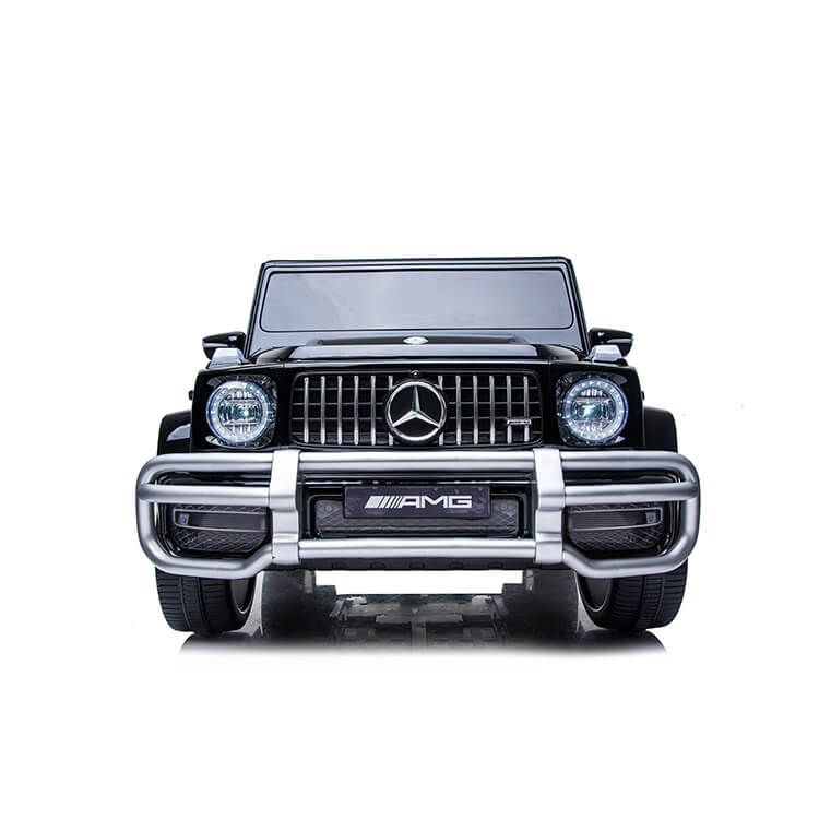 Front view of the Black 24V Mercedes Benz G63 Kids Ride On Car, complete with detailed grille, headlights, and bumper. This 4x4 replica features the iconic Mercedes logo and seats two for an authentic look. Powered by a 24V system and includes RC functionality.