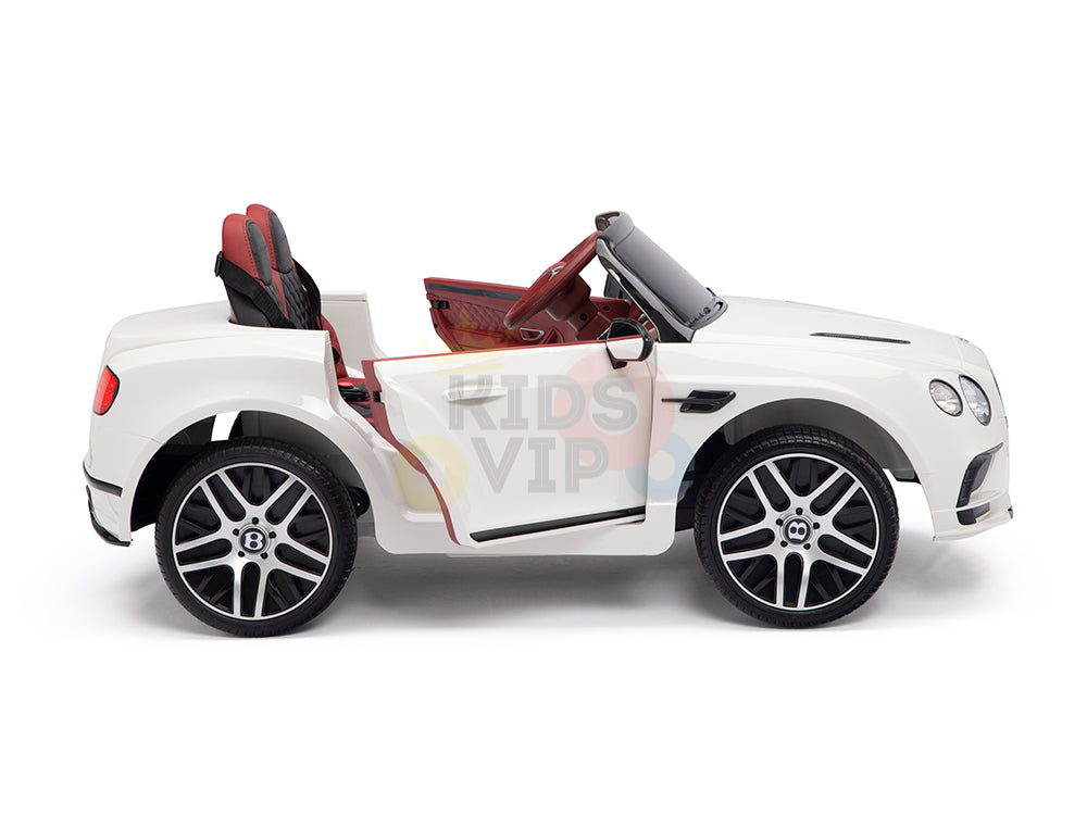 The White 12V Bentley GTC Kids Licensed Ride On Car boasts a luxurious white body, red interior, detailed silver rubber wheels, and an open door profile. This remote control car blends style and fun for young adventurers.