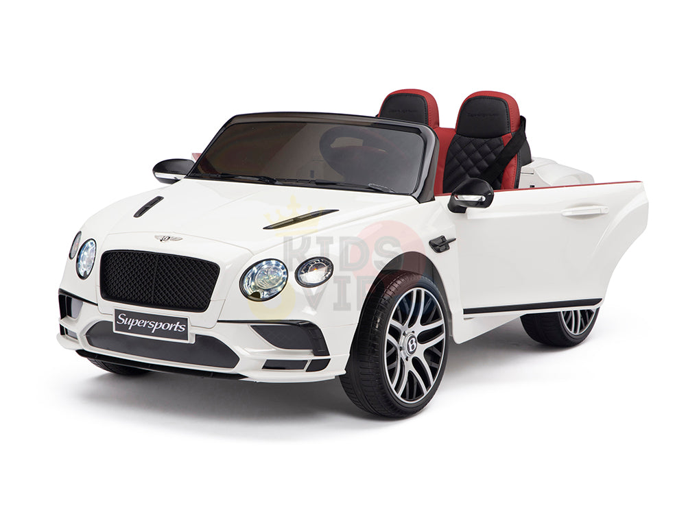 The White 12V Bentley GTC Kids Licensed Ride On Car comes with rubber wheels, black-and-red leather seats, open doors, realistic headlights and grill, and Supersports on the bumper. Its controlled by a remote for added fun.