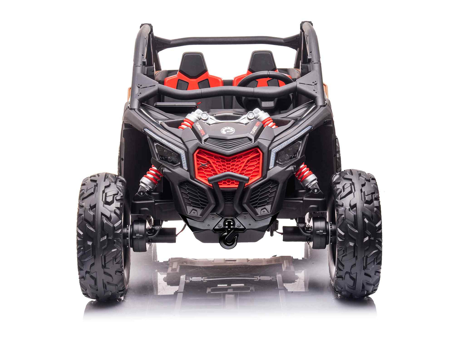 The 2 Seater Official 2x24v Can-Am Maverick RS Ride on Buggy, LX Performance 4WD Edition, is styled in black and red with large rugged tires and red shock absorbers. Its cabin features matching seats, showcased against a white background.