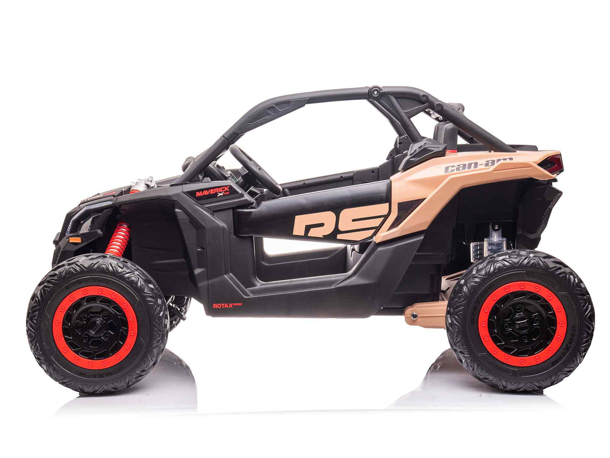 A side view of the 2 Seater Official 2x24v Can-Am Maverick RS Ride on Buggy, LX Performance 4WD Edition, in black and beige with large rugged tires and red accents. It boasts an open cabin design, sturdy frame, visible suspension components, and prominent branding on the side.