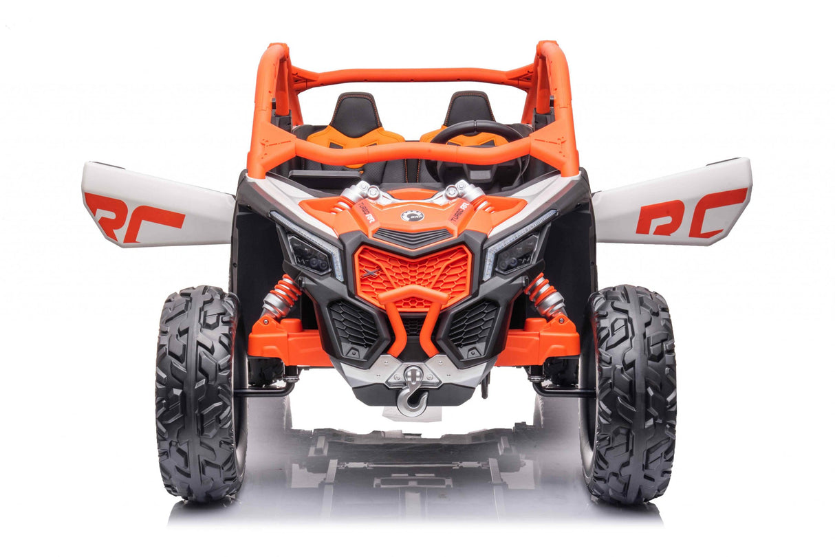 The Official Can-Am Maverick Ride-on Buggy, LX Performance, in orange, mirrors the real thing with large rugged wheels and open sides. It boasts a sporty design with a roll cage and visible suspension springs, complete with RC panels and Eco Leather Seats.