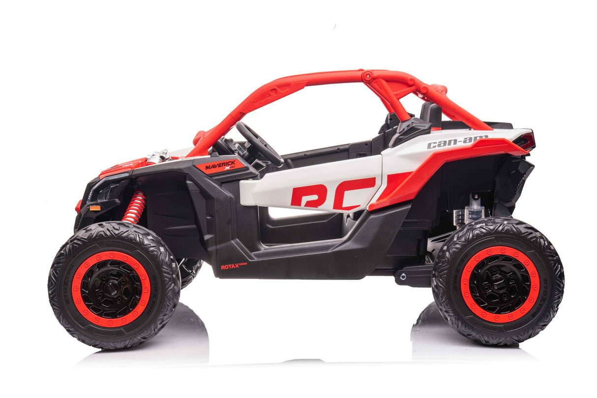 Side view of a Red 2x24V/4WD Official Can-Am Maverick Ride on Buggy, LX Performance toy car with large wheels on a reflective white surface, showcasing a detailed open cabin and distinctive red accents on the wheels and roll bars.