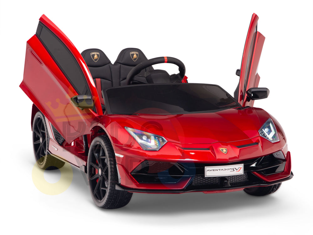 Experience an exciting drive with the Burgundy Red 12V Lamborghini SVJ Sport Kids Licensed Ride On Car featuring rubber wheels. This 1-seater has a realistic design with scissor doors, black seats, steering wheel, detailed rims, headlights, and remote control for kids to enjoy.