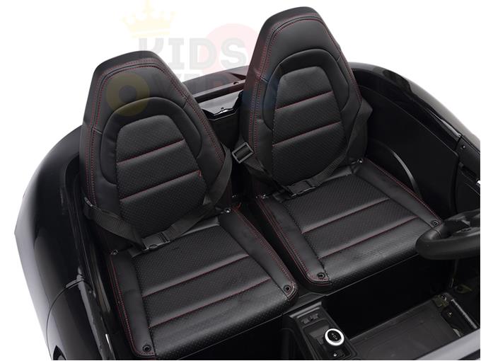 The Black 24V XXL SuperSport Big Kids Ride On Car features black ECO leather seats with red stitching, seatbelt buckles, and a right-side steering wheel. The KIDSVIP Supercar logo is partially visible in the background.