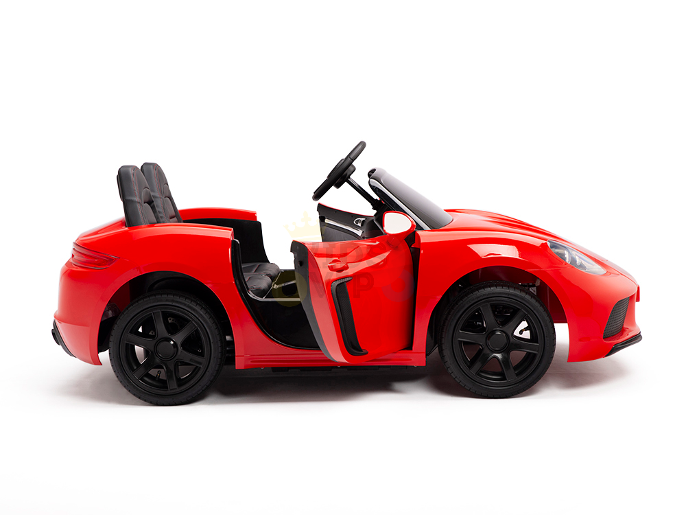 The Red 24V XXL SuperSport Big Kids Ride On Car features a sleek convertible design with black interior, two seats, a steering wheel, and a drivers side door ajar for realistic play. Its 180W brushless motor and real tires add luxury and adventure to young drivers playtime.