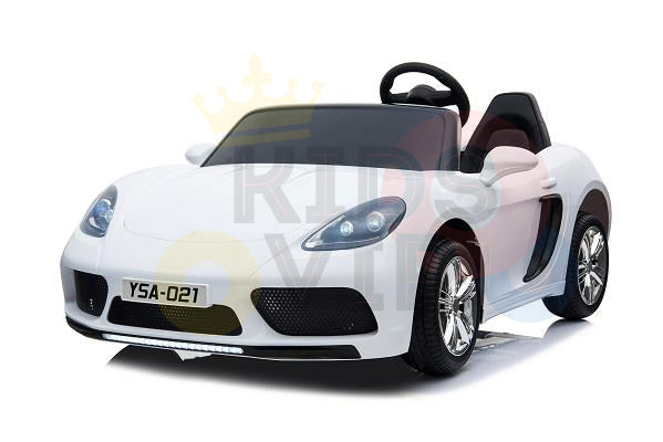 The White 24V XXL SuperSport Ride On Car for kids features a black steering wheel, detailed front lights, chrome wheels resembling those of a sleek sports car, and the number plate YSA-021 for authenticity. It includes a 180W brushless motor and real tires.