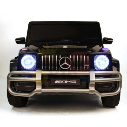 The Black 24V/4x4 Official Mercedes Benz G63 Ride On Car with RC features illuminated headlights, a prominent grille with AMG logo, and a silver bumper guard. Powered by a strong 24V battery, it offers an exhilarating playtime experience for kids.