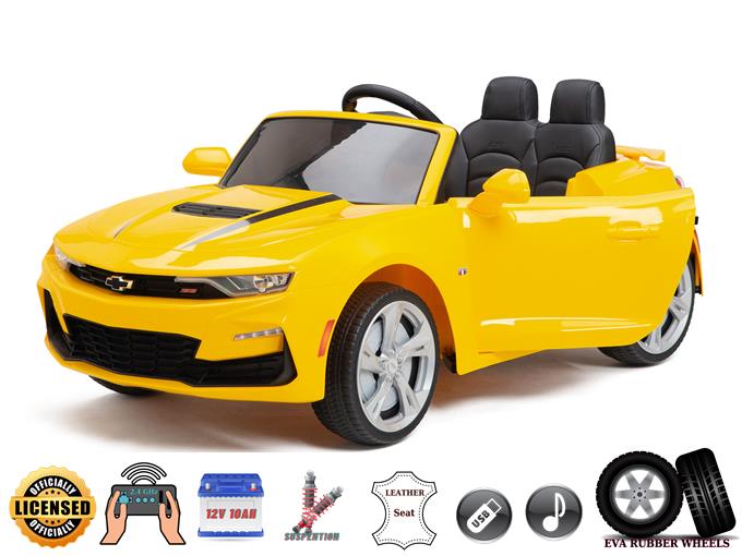 The Yellow 12V Official Sport Chevrolet Camaro Ride-on Car for kids features two black seats, leather seating, a small steering wheel, a licensed logo, USB connectivity for music, rubber wheels, and battery power. Includes a seatbelt and parental remote control for extra safety and fun.