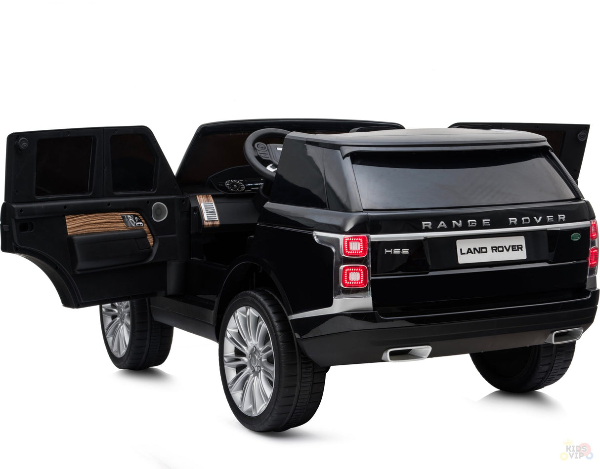 The Black 24V Official Range Rover Complete MP4 Edition Kids Ride On Car with RC boasts opening doors, a detailed interior, visible taillights, and branding. Its glossy finish and realistic details like wheels and dashboard make it an impressive toy car.