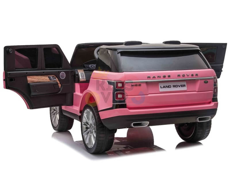 The Pink 24V Official Range Rover Complete MP4 Edition Kids Ride On Car with RC is showcased with open black doors, realistic details like a sleek trunk, tinted windows, and shiny wheels.