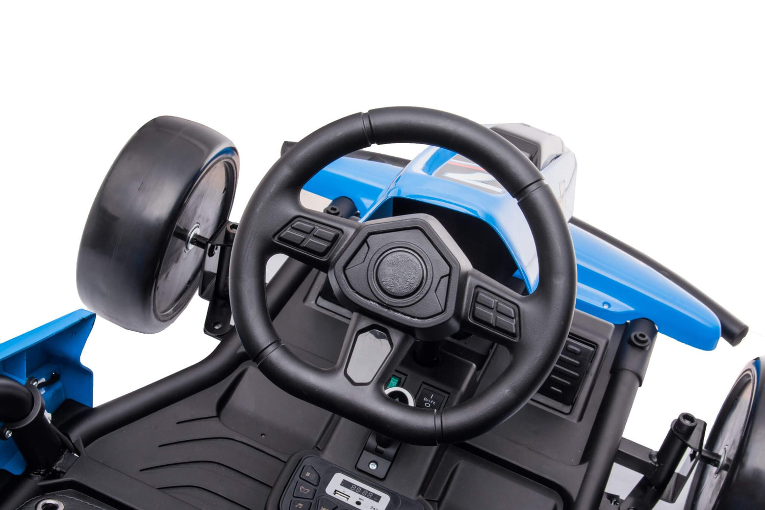 Close-up of a Blue Big Kids 24 Volt Ultra-Violent Complete Edition Drifting Go-Karts interior, with a black steering wheel and dashboard. It has EVA-rubber wheels, simulated controls, and a secure seating area perfect for high-speed drifting adventures.