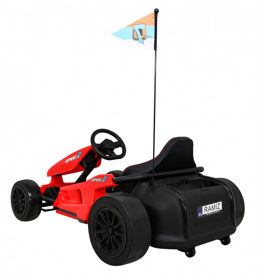 Introducing the Red 24V Ultra-Violent Big Kids Complete Edition Drifting Go-Kart: a red and black ride-on with large wheels, a steering wheel, high backrest, and flagpole sporting a small red and blue checkered flag. Speed 1 decals on the sides promise an exhilarating experience.