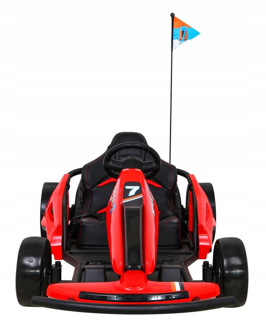 A Red 24V Ultra-Violent Big Kids Complete Edition Drifting Go-Kart is shown from the front, featuring a black seat and steering wheel. A flag with its logo and number 7 adorns it, while wide black wheels enhance its sporty design for young speed enthusiasts.
