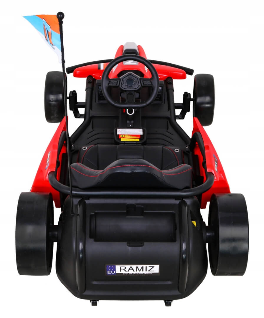 The RAMIZ EU Red 24V Ultra-Violent Big Kids Complete Edition Drifting Go-Kart features black wheels, a steering wheel, and a multicolored flag on its rear flagpole, promising thrilling rides.