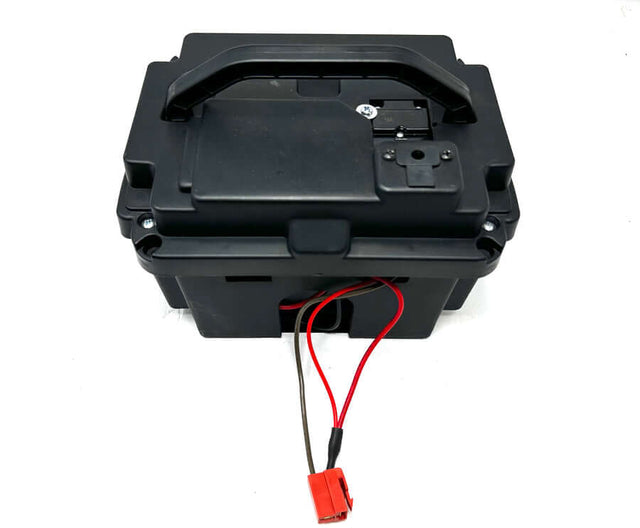 A black 24V battery pack for a Can-am Maverick with visible wiring.