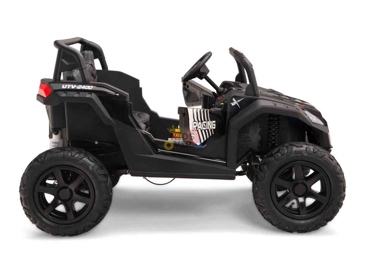 The Black 24V/180W XXL Big Kids Blade XR Ride on Buggy features a sleek, black side profile with inflatable rubber tires and open seating. It includes ECO leather seats, a steering wheel, and dashboard area with decals enhancing its off-road-style design.