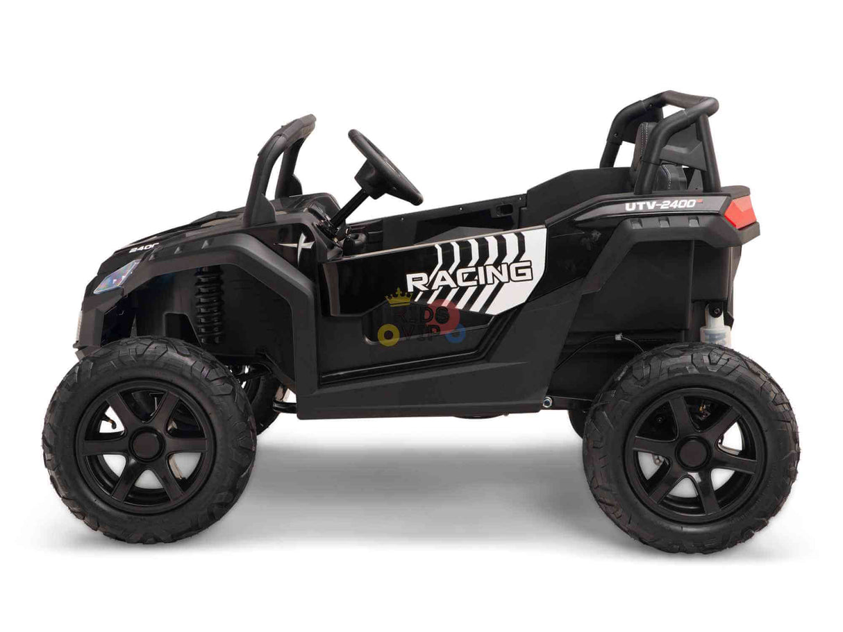 The Black 24V/180W XXL Big Kids Blade XR Ride-on Buggy, shown from the side, has large inflatable rubber tires with RACING text and design. Resembling an off-road vehicle, it features a roll bar, ECO leather seats, and a steering wheel.