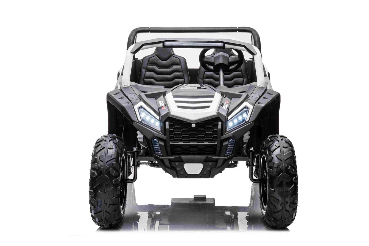 The White 24V/180W XXL Big Kids Blade XR Ride on Buggy features a black-and-white off-road design with inflatable rubber tires for superior grip. With angular headlights and a rugged grille, its perfect for tackling any terrain.