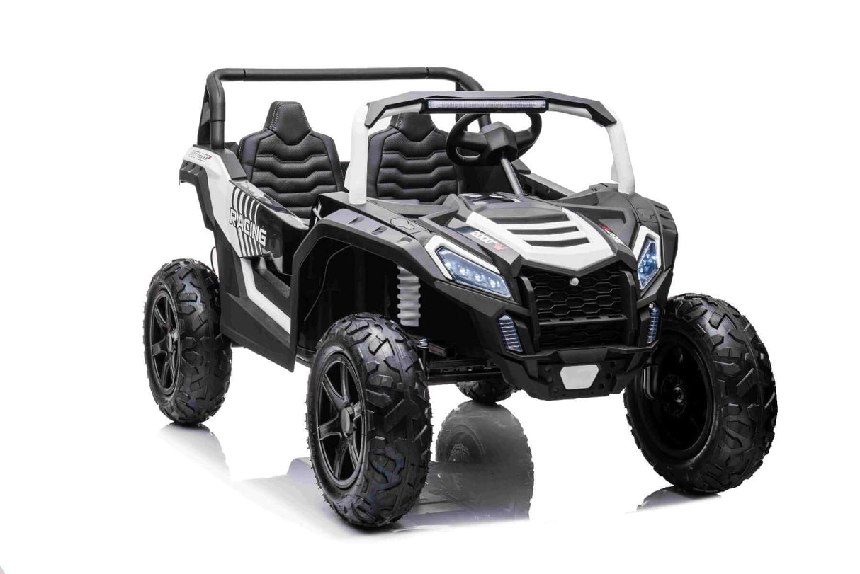 The White 24V/180W XXL Big Kids Blade XR Ride on Buggy features two seats, inflatable rubber tires, a steering wheel, and large rugged wheels. Its design includes detailed headlights and a grille for an authentic off-road adventure experience.